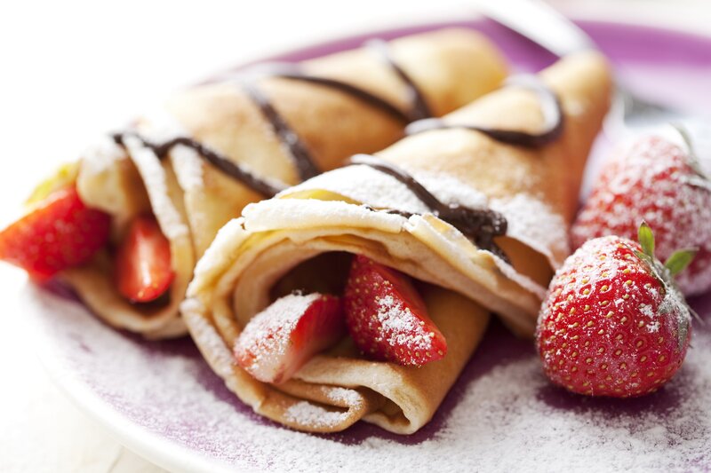 strawberry crepes with chocolate drizzle