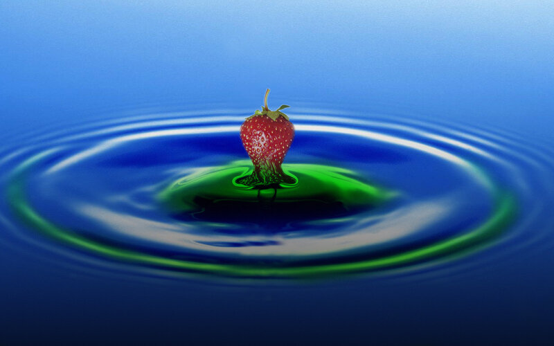 strawberry dropping into water