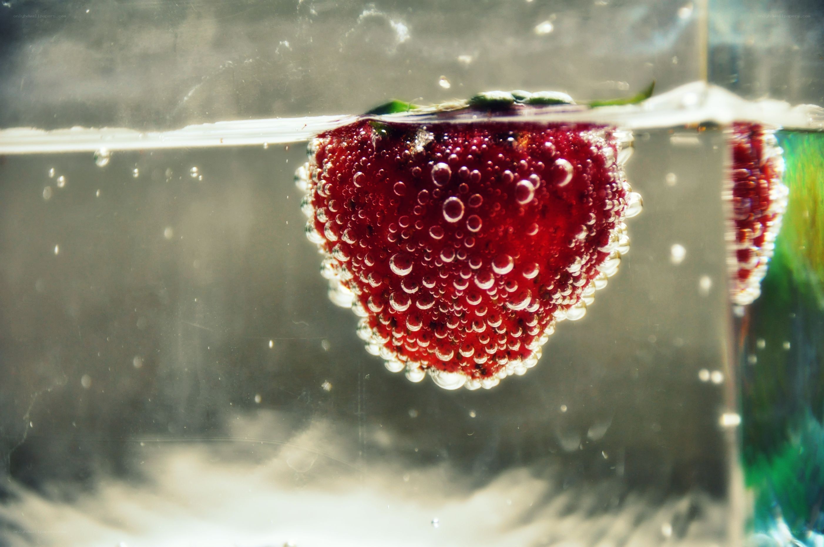 strawberry in carbonated water