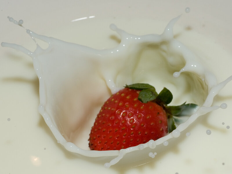 Strawberry in Milk Splash — Red, Dynamic, Photograph, Green Leaves, White, Green