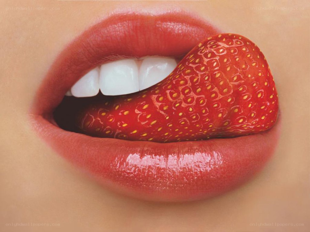 strawberry in mouth close-up