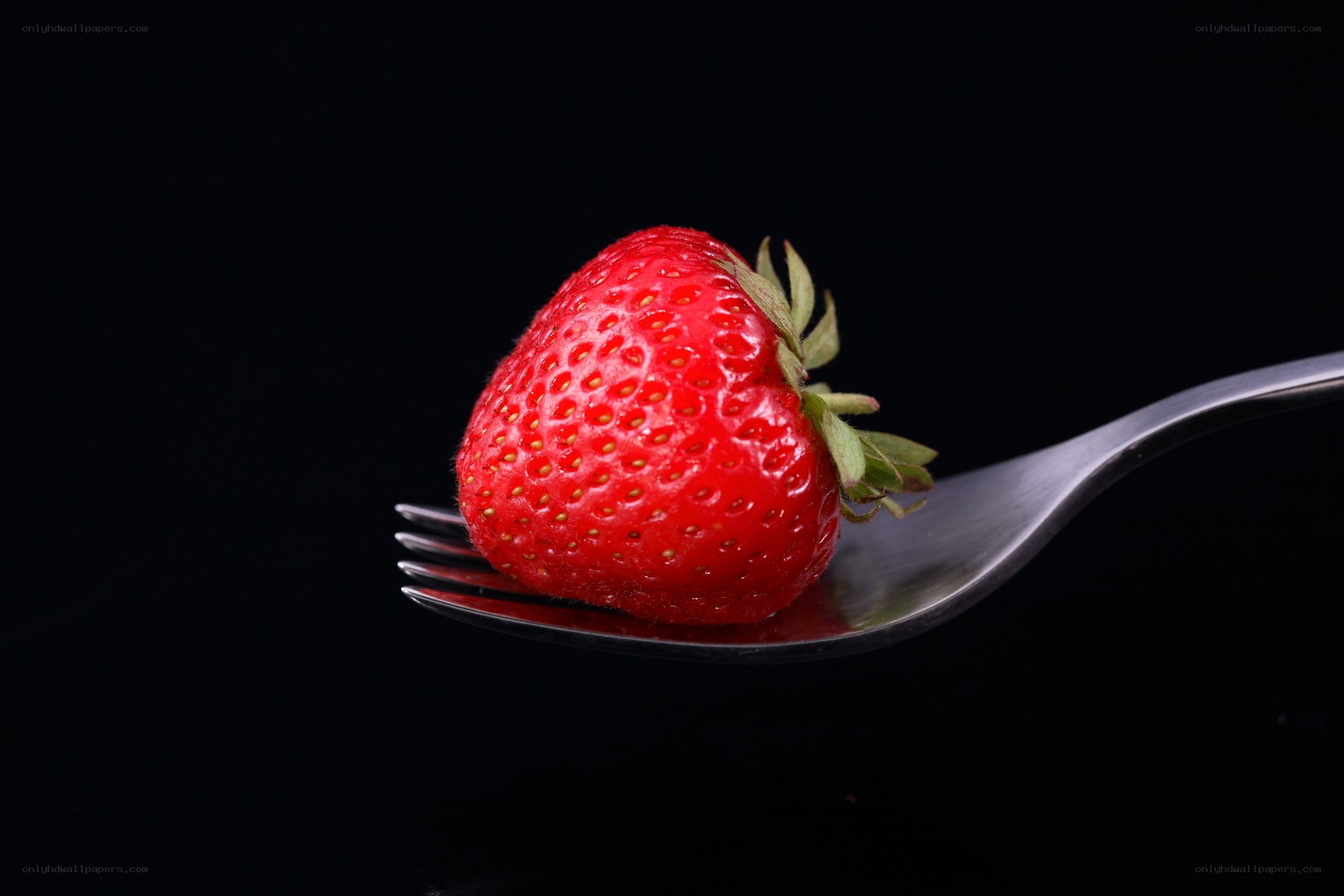strawberry on a fork