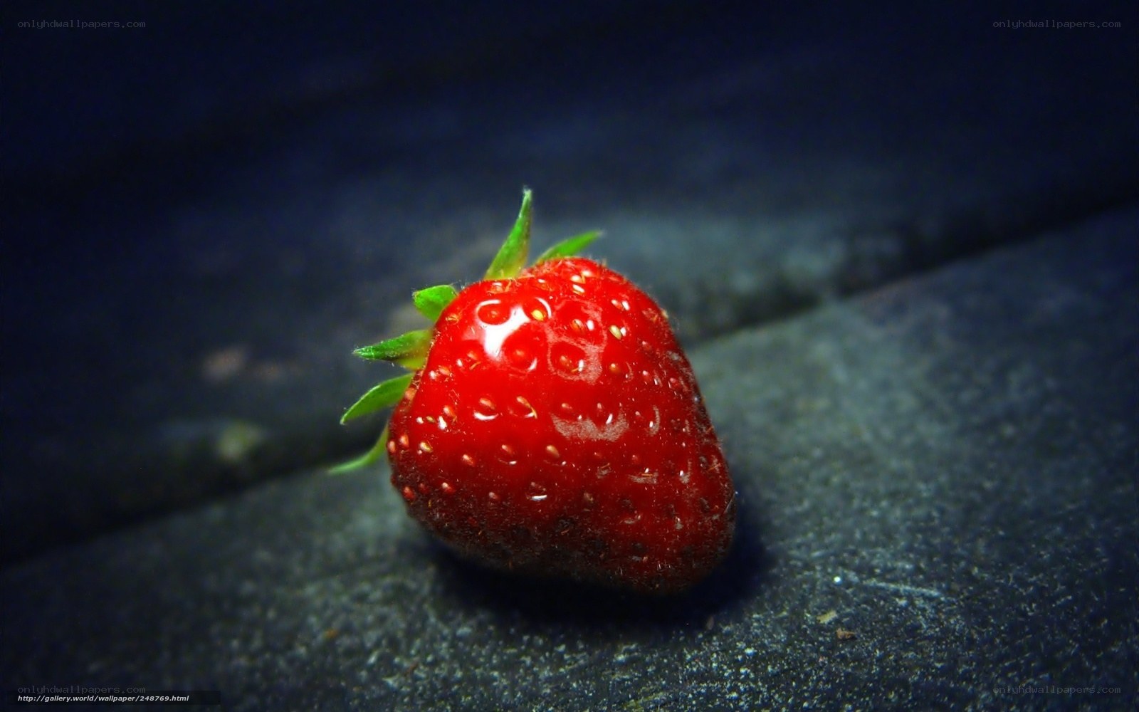strawberry on dark surface
