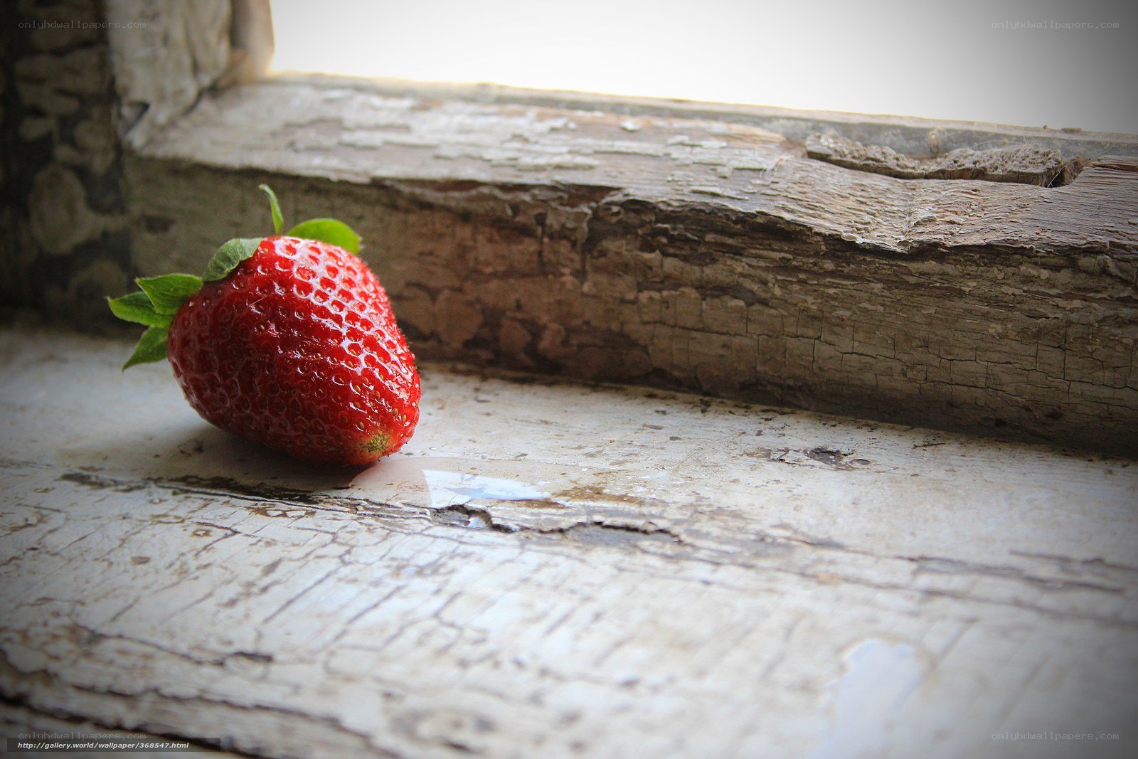 strawberry on old windowsill