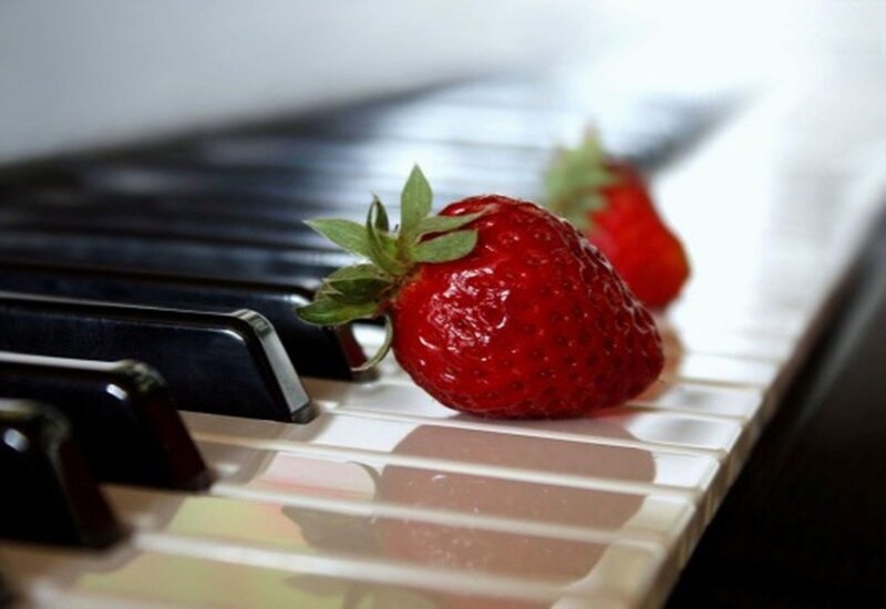 Strawberry on Piano Keys