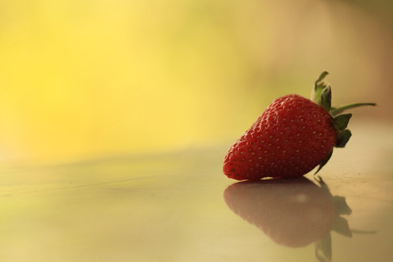 strawberry on reflective surface