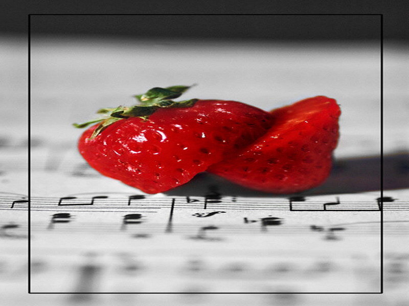 strawberry on sheet music