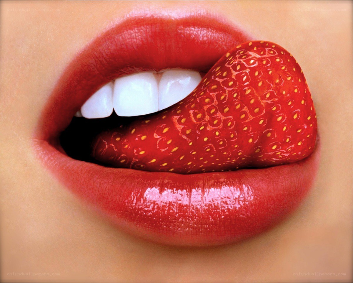 strawberry on tongue close-up