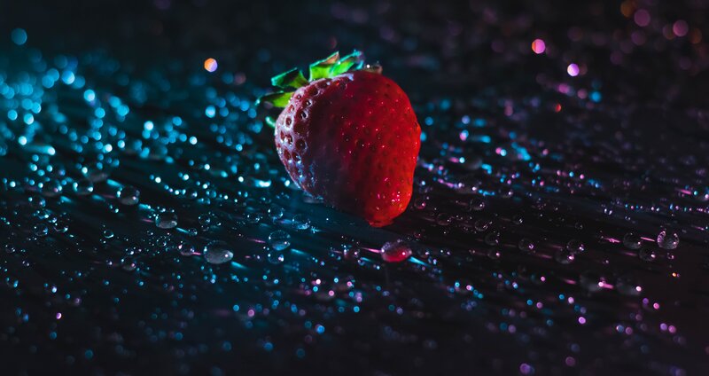 strawberry on wet surface