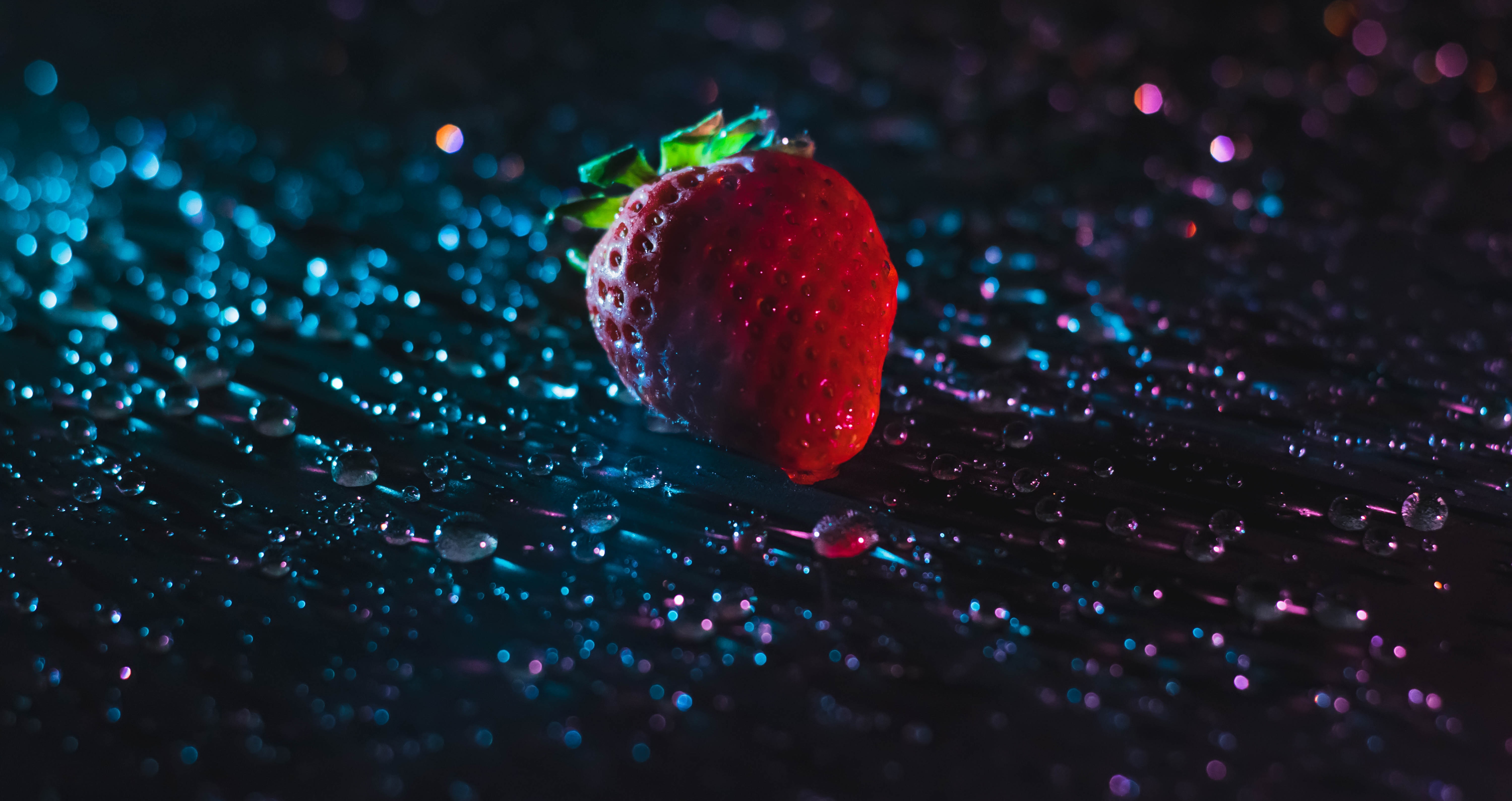 strawberry on wet surface