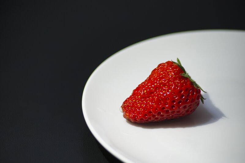 strawberry on white plate