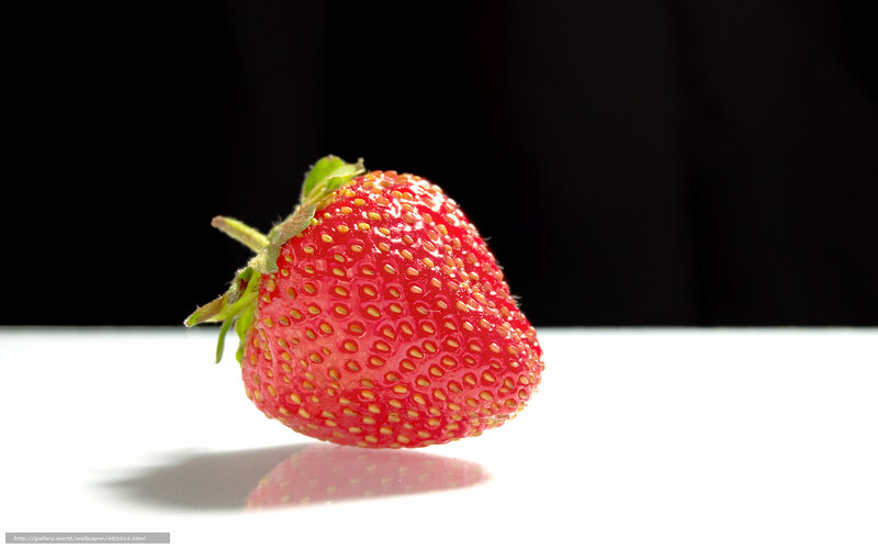 strawberry on white surface