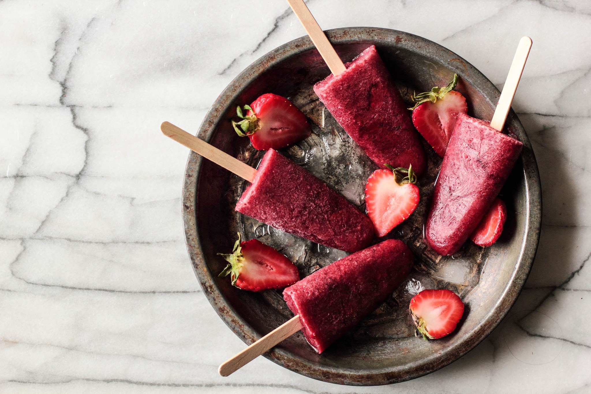 strawberry popsicles on ice