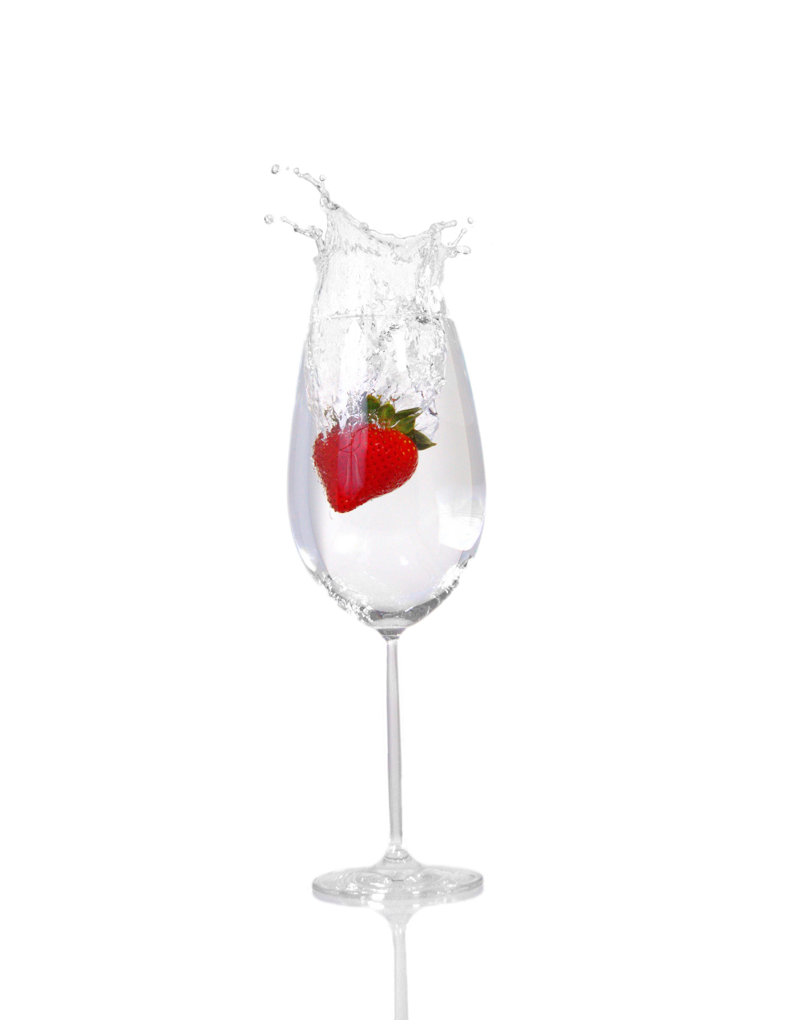 strawberry splashing in glass