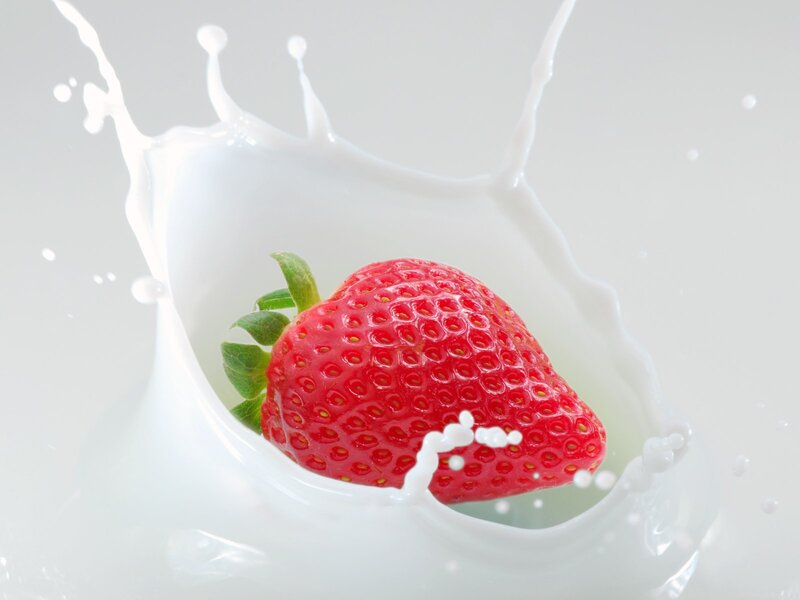 strawberry splashing in milk