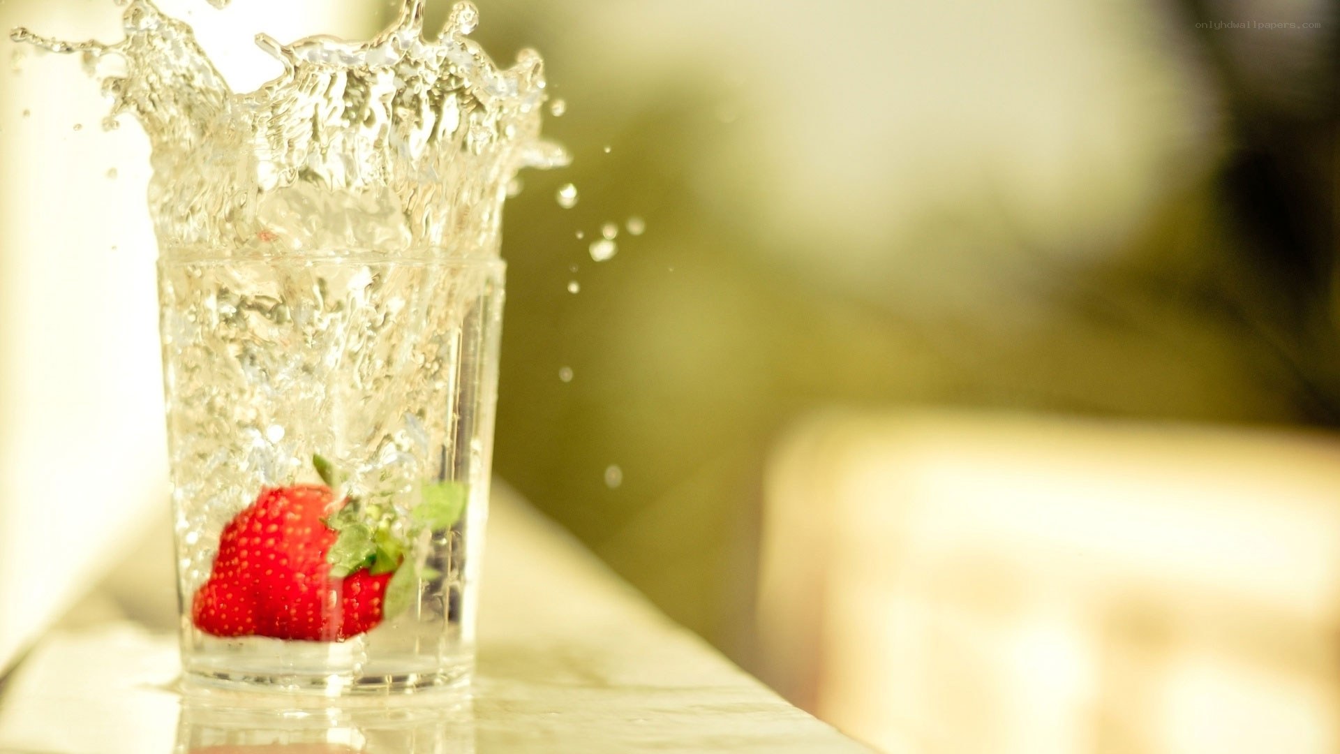 strawberry splashing in water