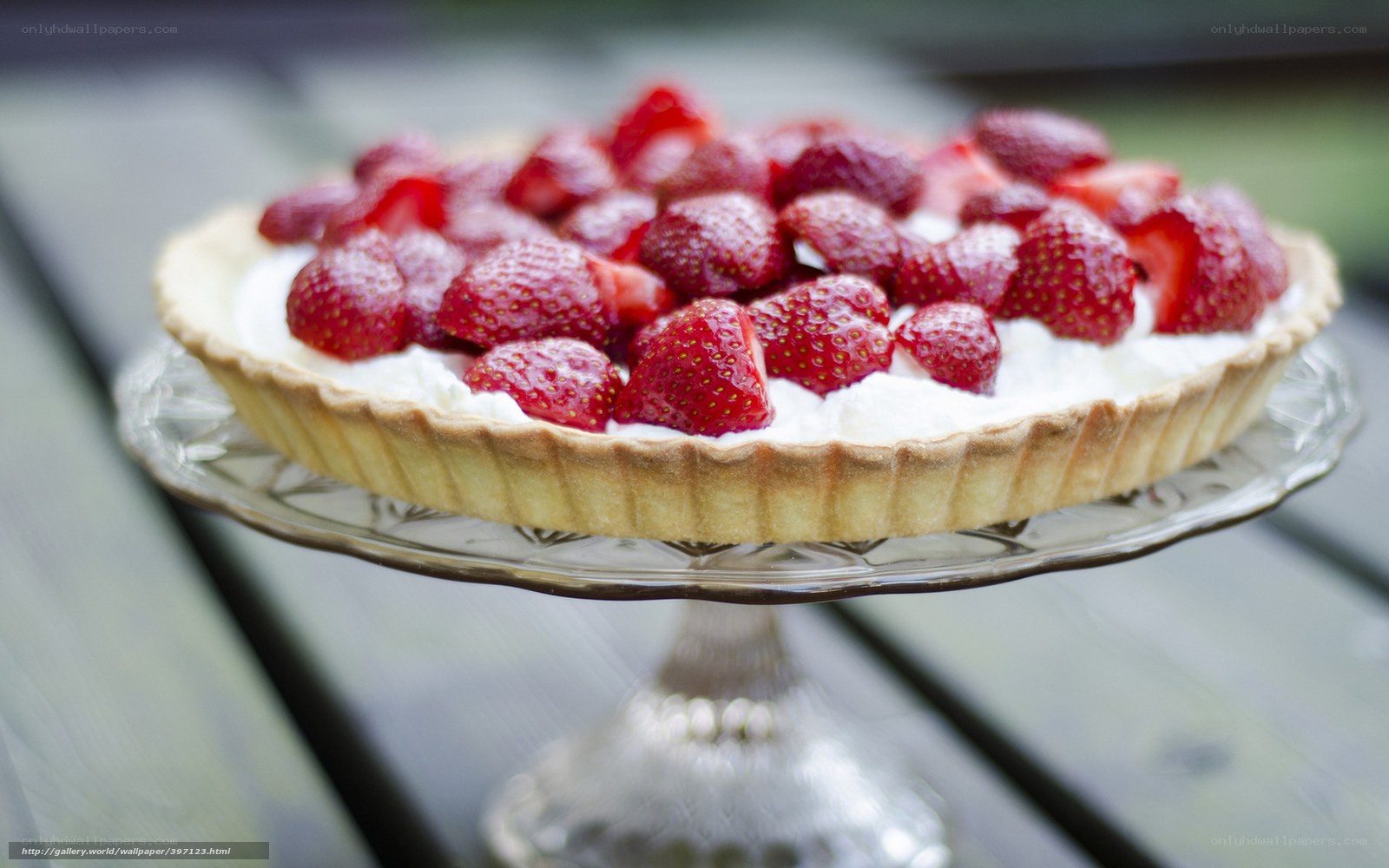 strawberry tart on glass stand