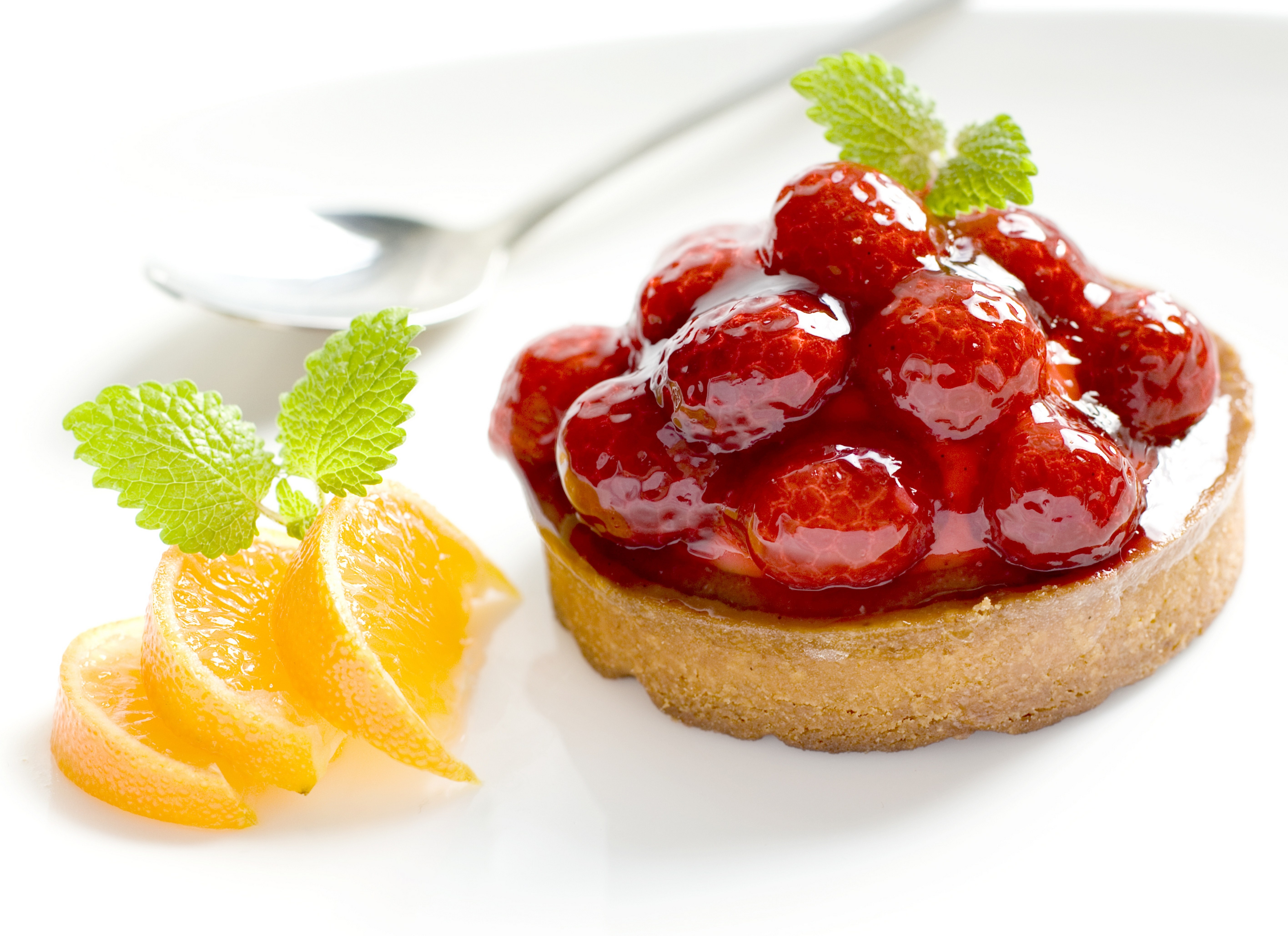 strawberry tart with orange slices