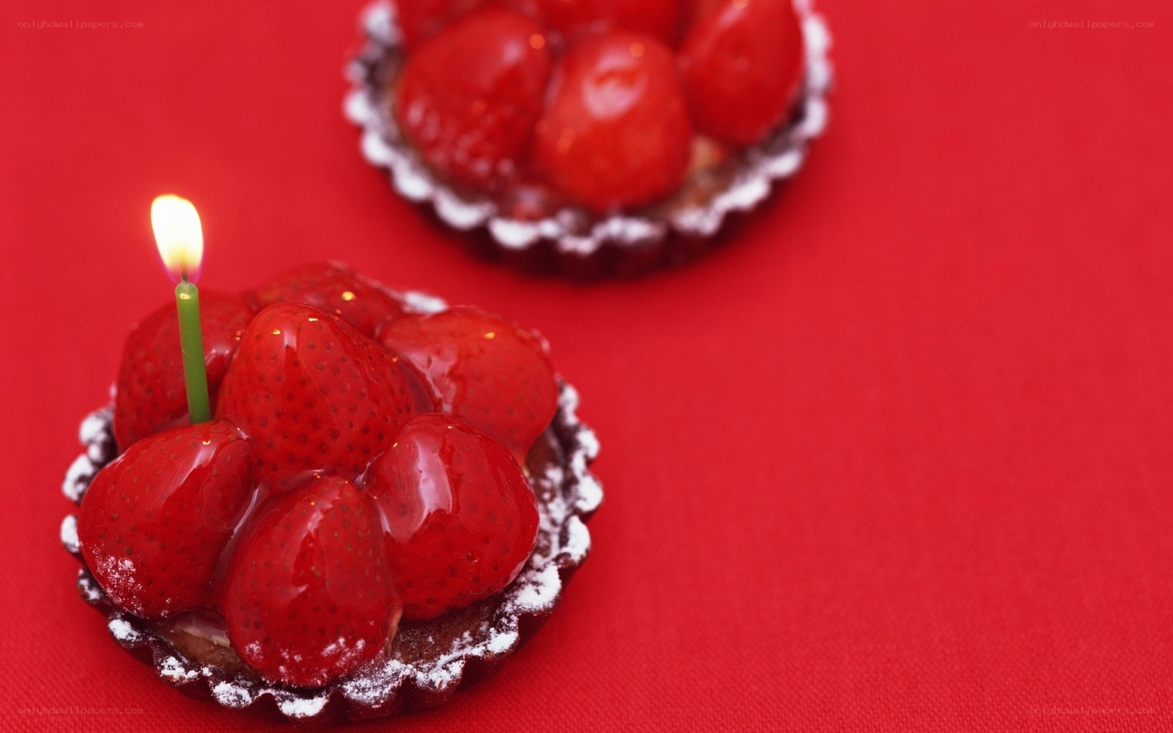 Strawberry tarts with candle