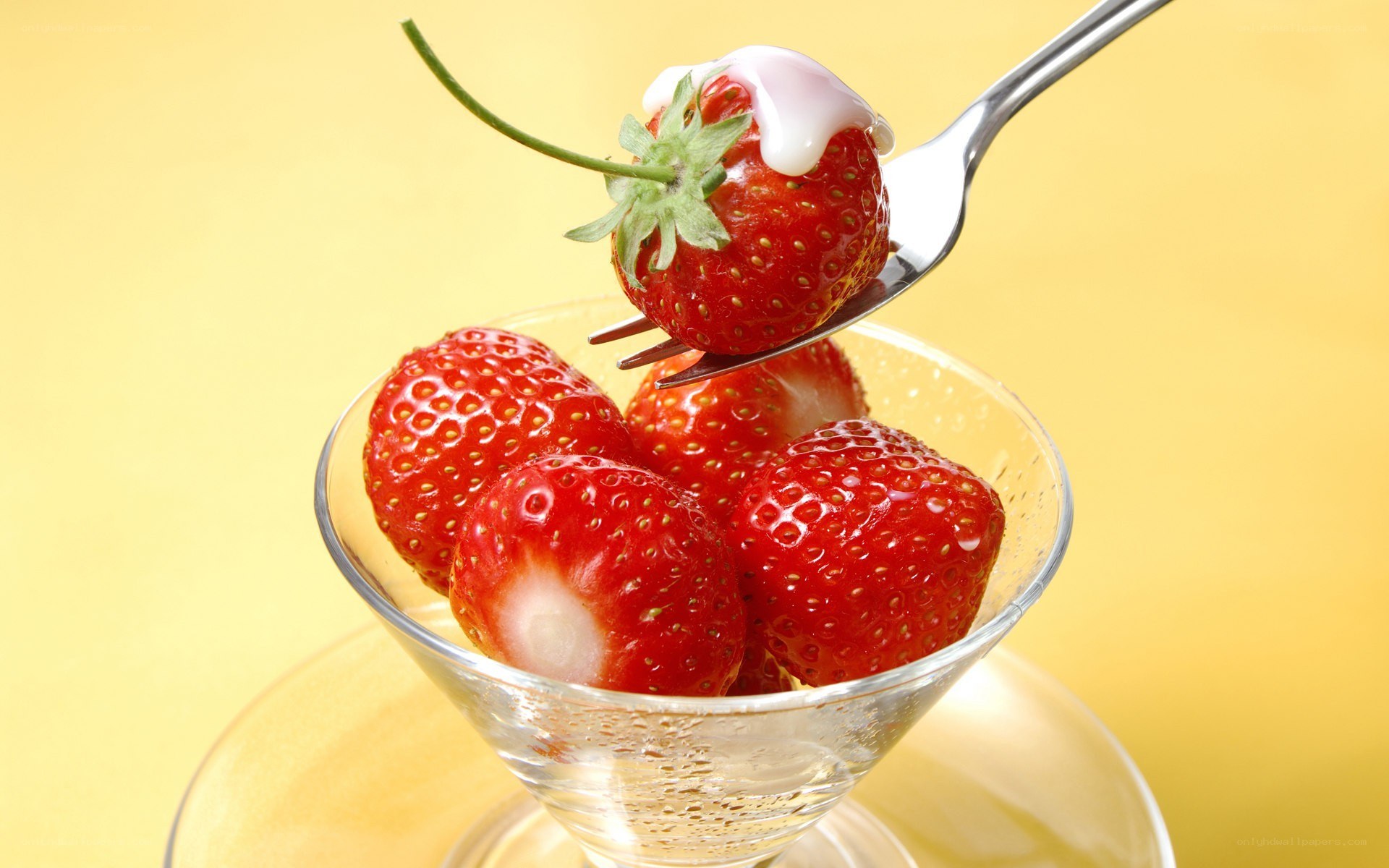 strawberry with cream on fork