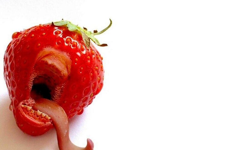 strawberry with mouth and tongue