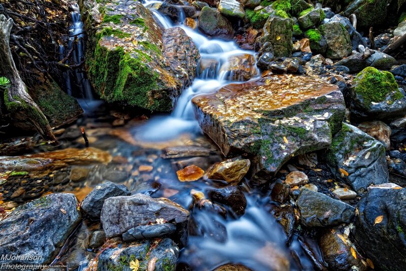Stream flowing over mossy rocks