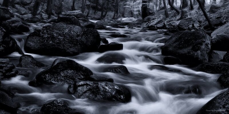 Stream Flowing over Rocks — Black, Serene