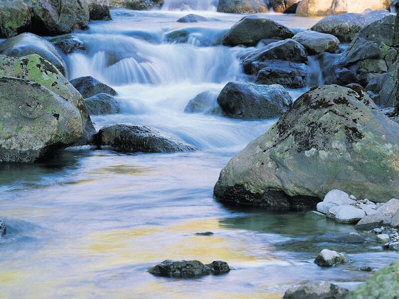 Stream Flowing over Rocks — Blue