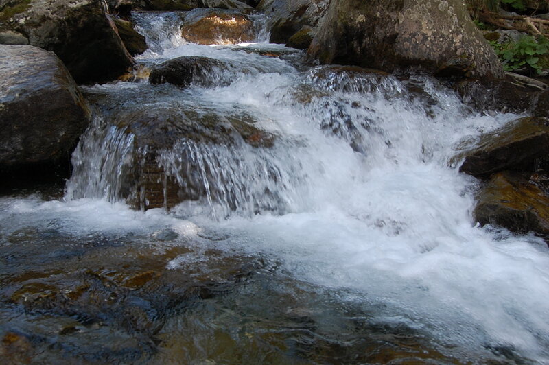 Stream Flowing over Rocks — Brown, Active