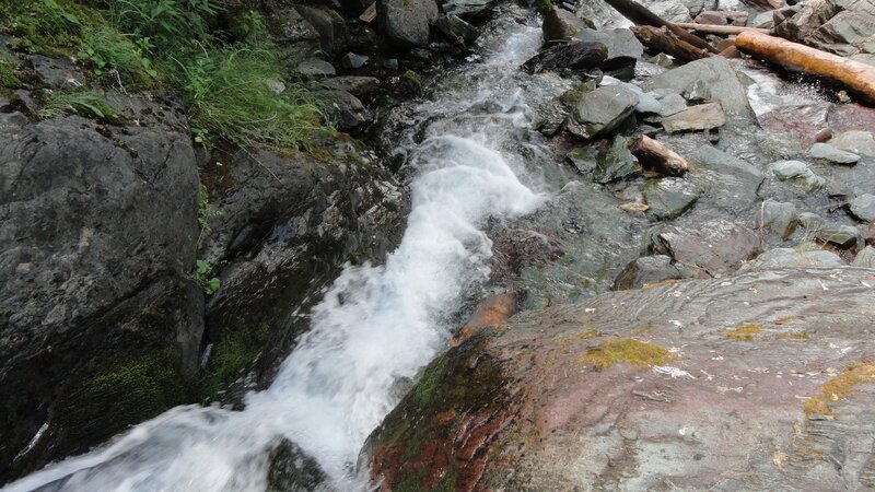 Stream Flowing over Rocks — Gray, Natural, Photograph, Logs