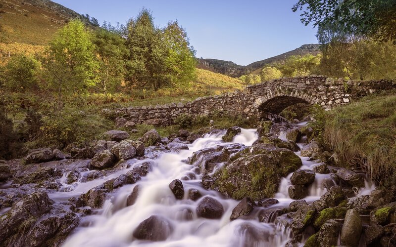 Stream Flowing over Rocks — Green, Serene, Autumn, Photograph, Stone Bridge