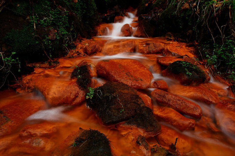 Stream Flowing over Rocks — Orange