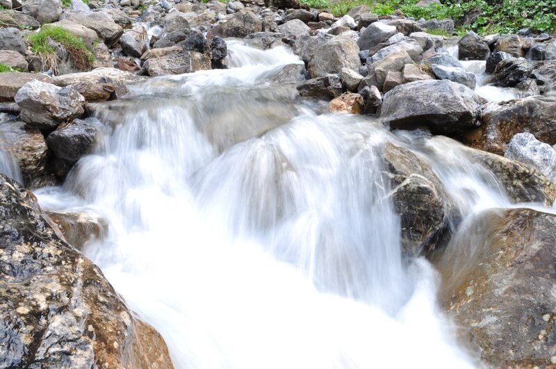 Stream Flowing over Rocks — White