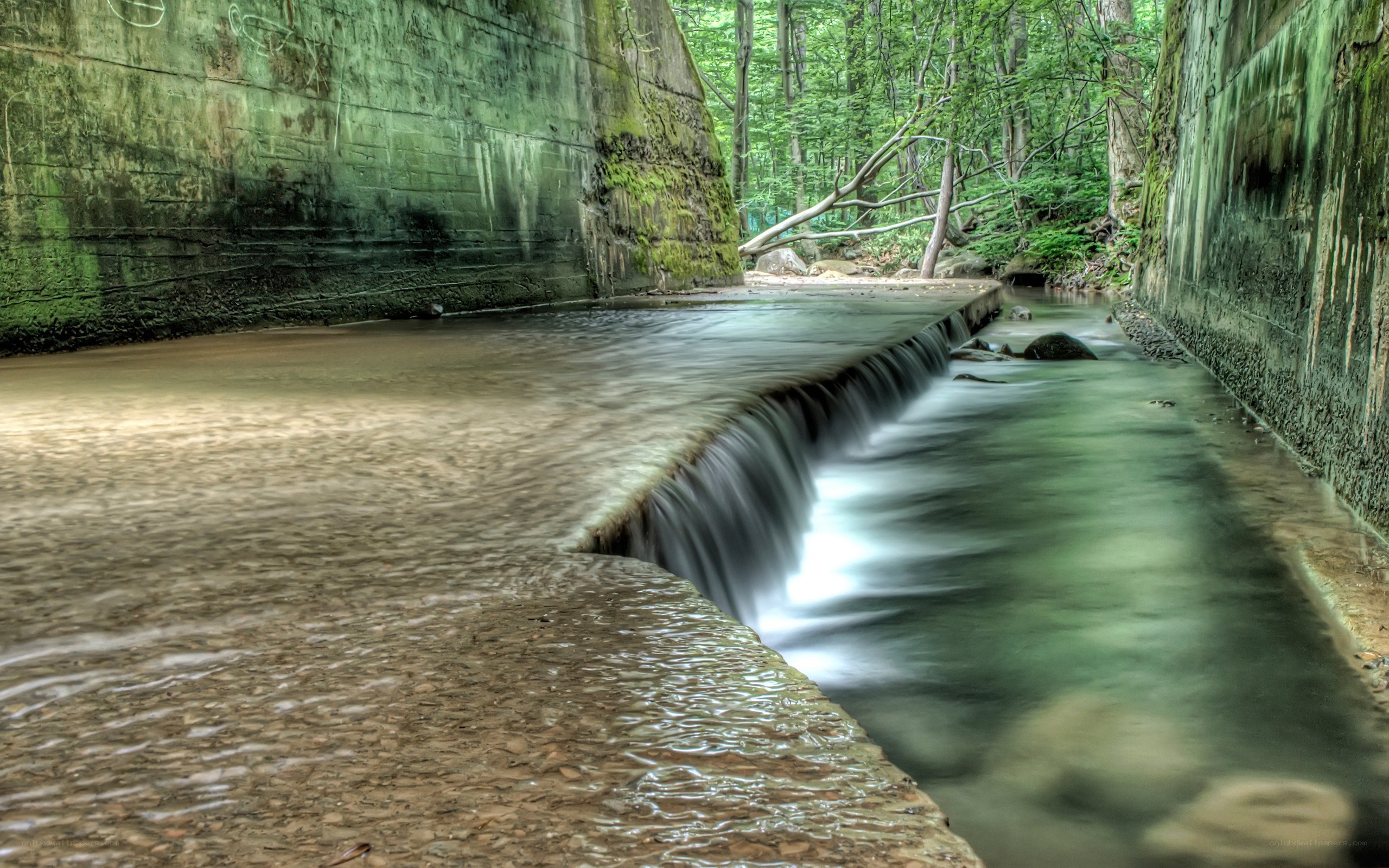 Stream flowing through a concrete channel