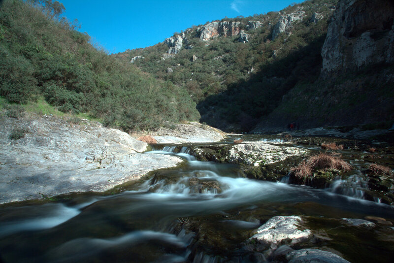 Stream Flowing Through Canyon
