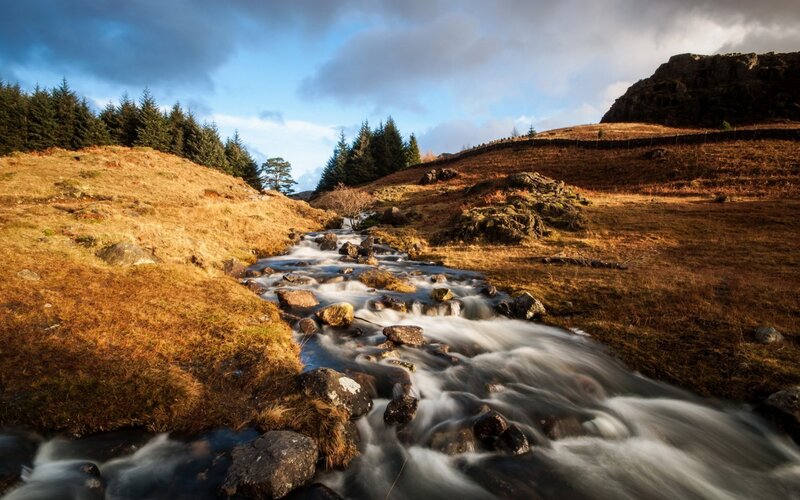 Stream Flowing Through Hills