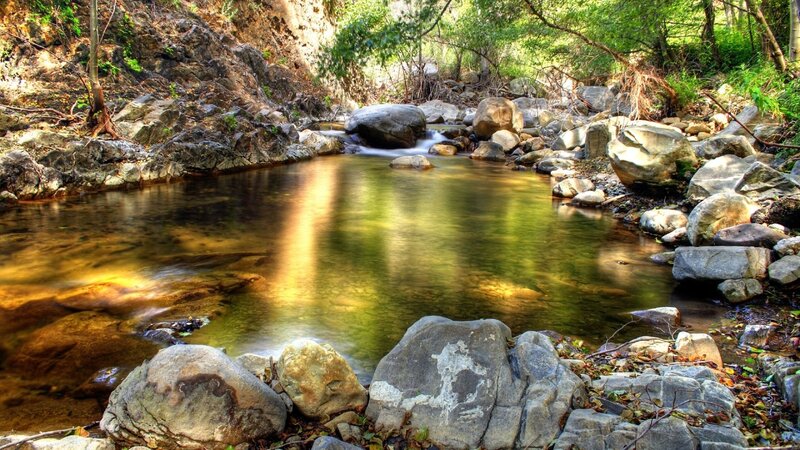 Stream Flowing Through Rocks — Green, Serene