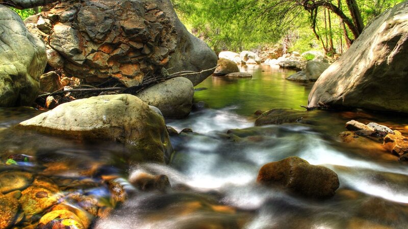 Stream Flowing Through Rocks — Green