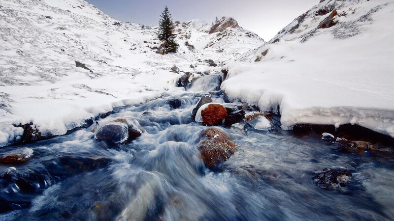 Stream in Snowy Mountains