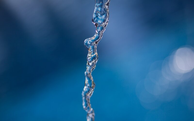 stream of water against blue