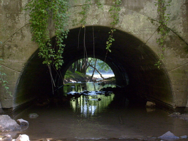 Stream under a stone bridge