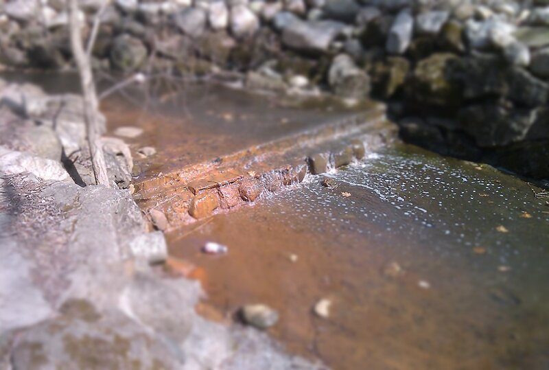 stream with rust-colored water