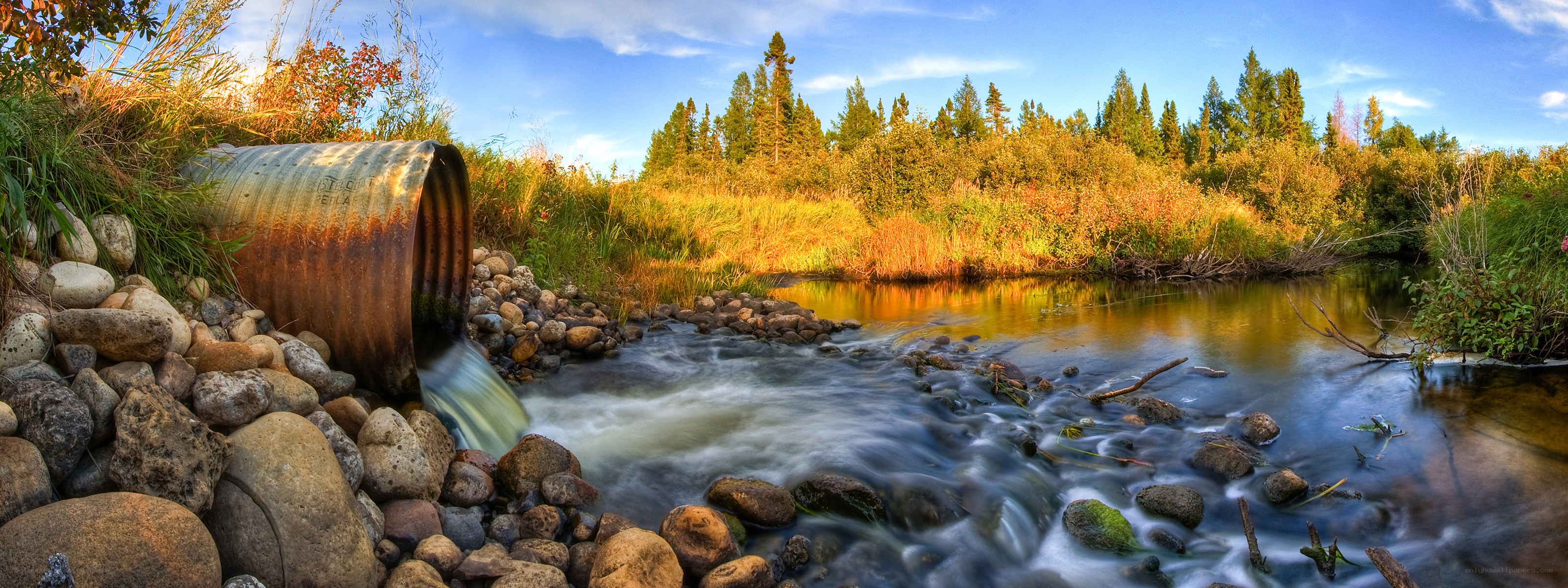 Stream with Rusty Pipe Outlet