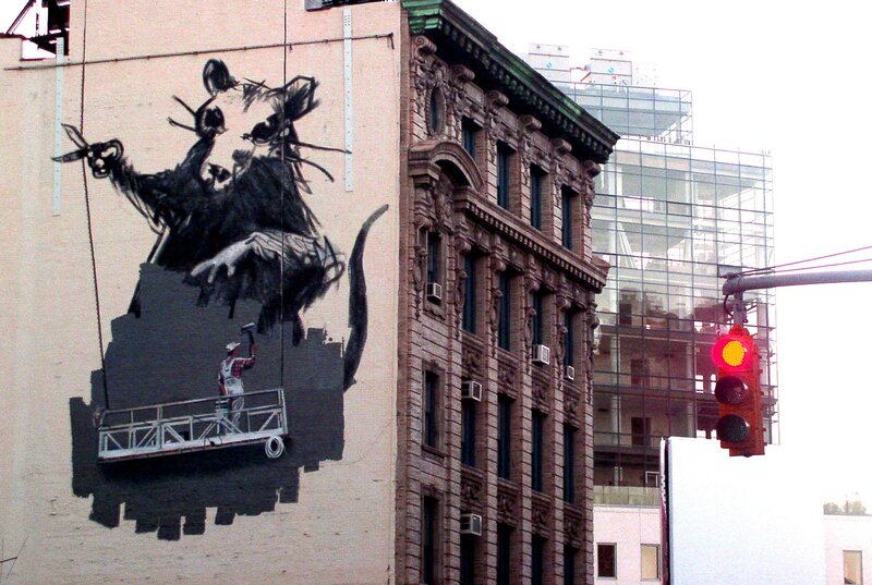 Street art mural of rat painter
