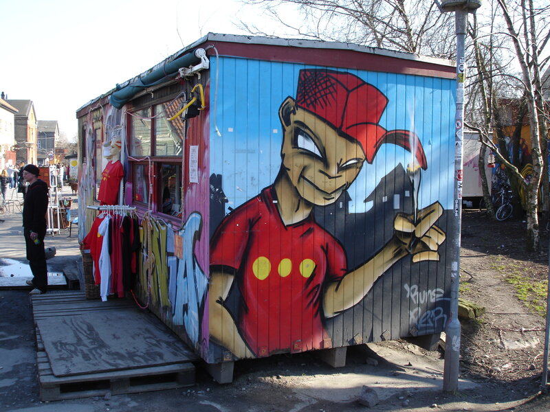 Street art mural on a small shop