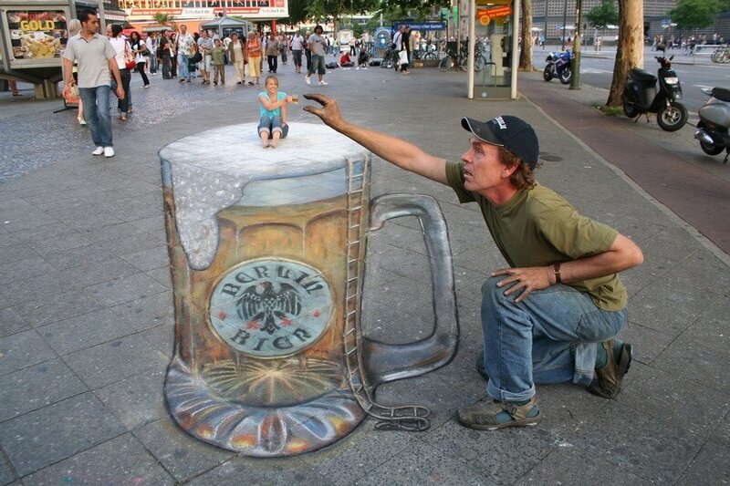 Street artist creates 3D beer mug illusion