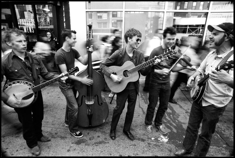 Street band performing on sidewalk