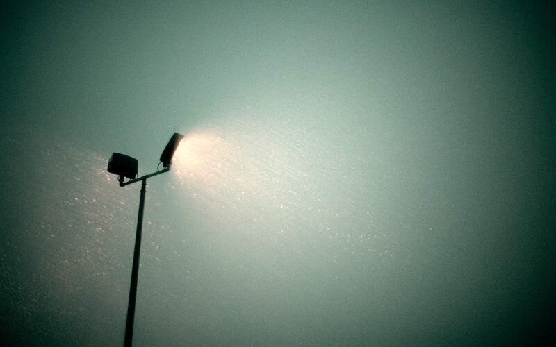 Street lamp in foggy night