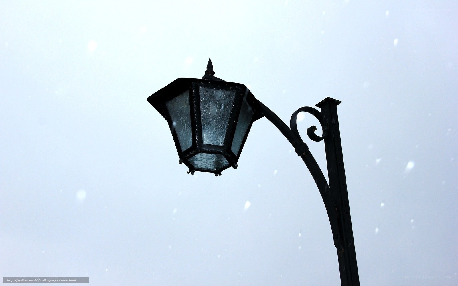 street lamp in snowfall