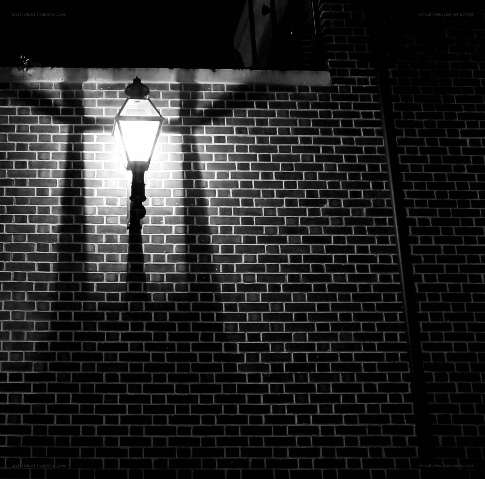 Street lamp on brick wall